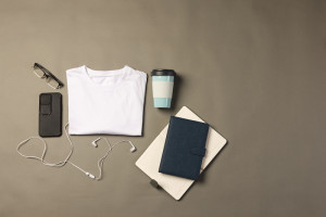 flat lay of white t shirt smartphone earphones a 2023 11 27 05 31 31 utc